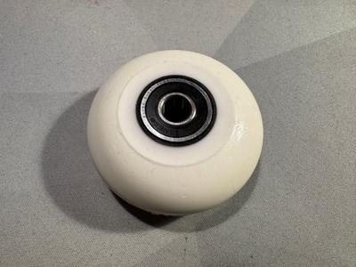 A wheel with one bearing installed, seal on the outside.