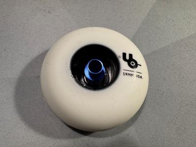 The wheel with the bearing installed at the bottom, the spacer installed in the bottom bearing.